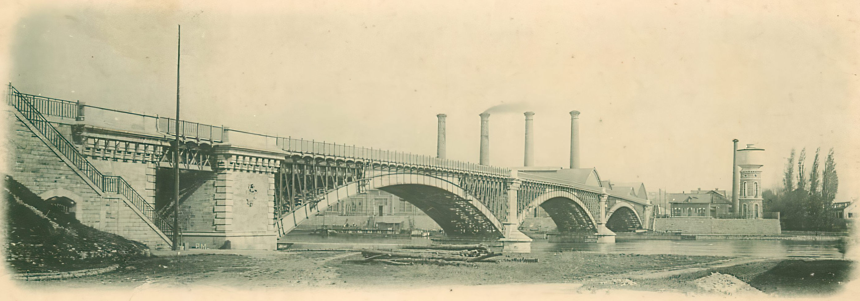 Historic railway and road bridge crossing the Seine at Argenteuil, photographed around 1900, showing the industrial modernity that fascinated Claude Monet during his Impressionist years.